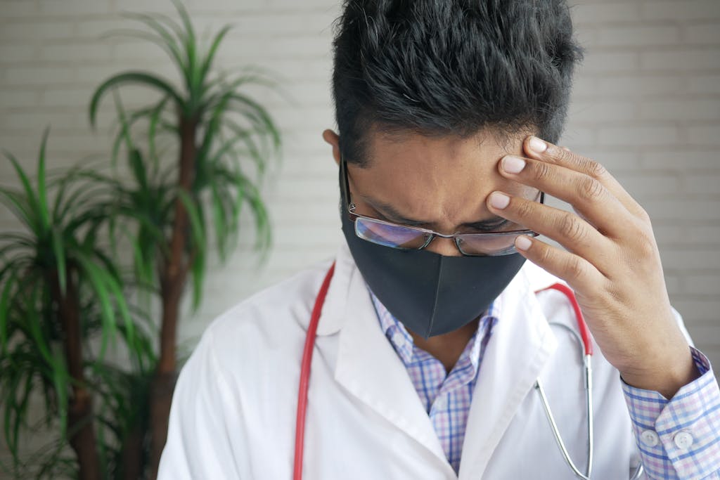 Pensive Doctor Wearing Face Mask